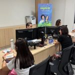 Representação gráfica de crescimento econômico e logomarca do programa MT Garante de Mato Grosso.